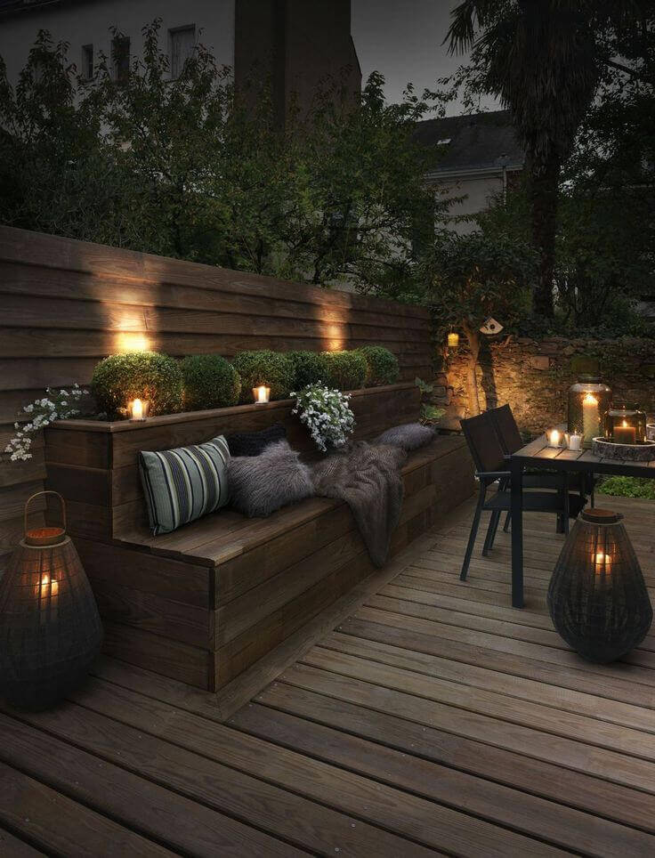 Upscale Outdoor Seating Bench Lit by Candles