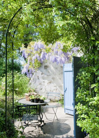 An idyllic French patio with fragrant wisteria and old stone walls — it’s as if the bistro table and chairs were made for this spot. This outdoor furniture set is compact and portable and can fit on the smallest of patios. And of course it brings that French country magic along with it.