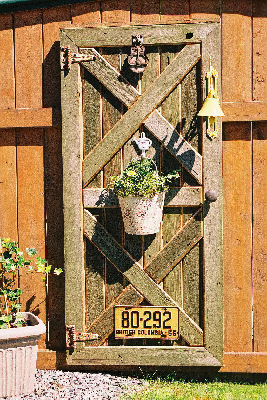 Hang an Old Door on the Fence | Creative Repurposed Old Door Ideas & Projects For Your Backyard