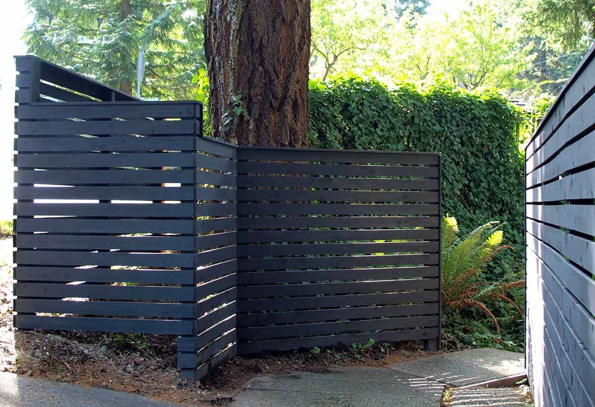 DIY Fence Ideas: Darkly Painted Wooden Garden Fence