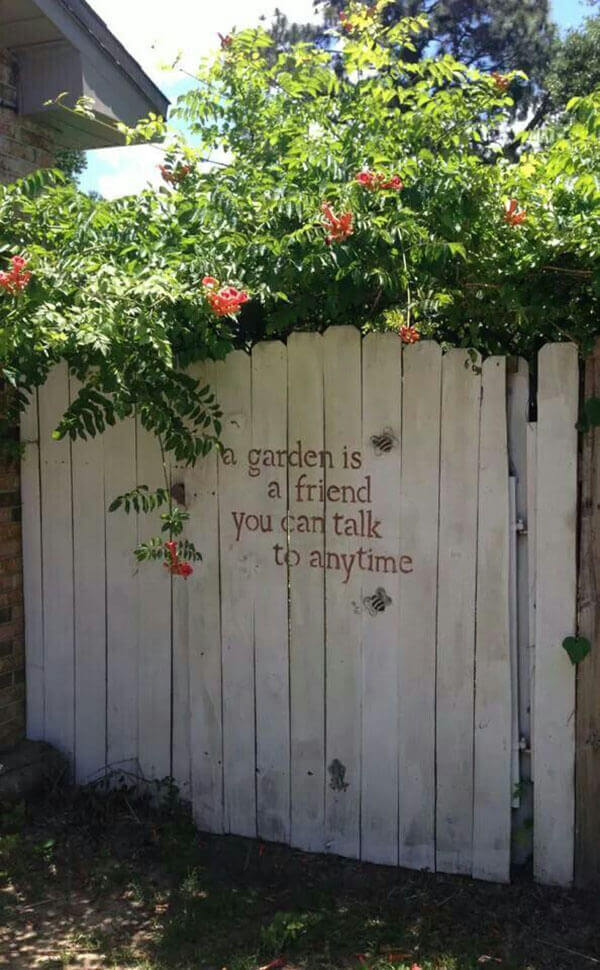  Stenciled Message on a Whitewashed Garden Gate | Funny DIY Garden Sign Ideas