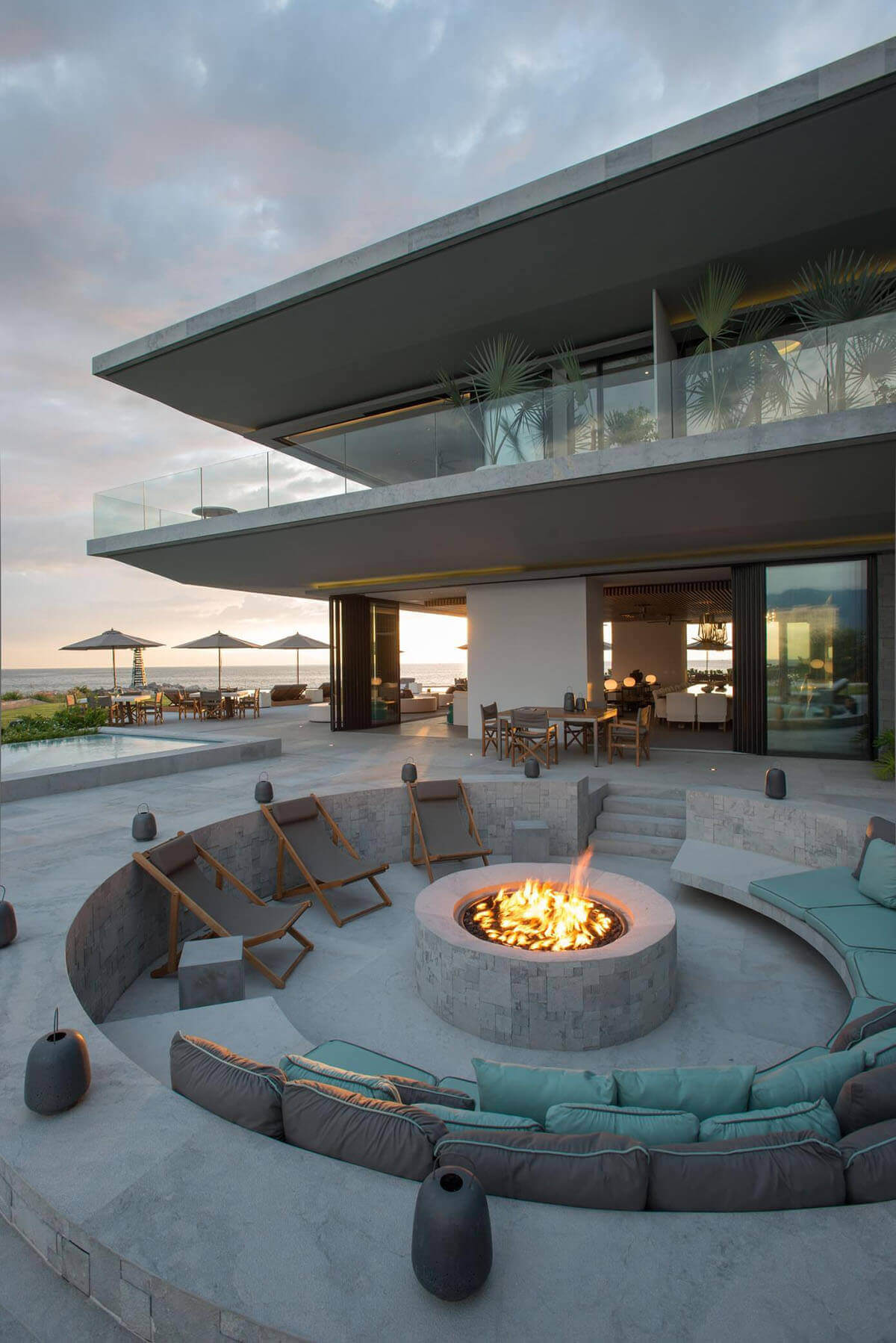 A Sunken Concrete Firepit with Comfortable Seating | Awesome Firepit Area Ideas For Your Outdoor Activities