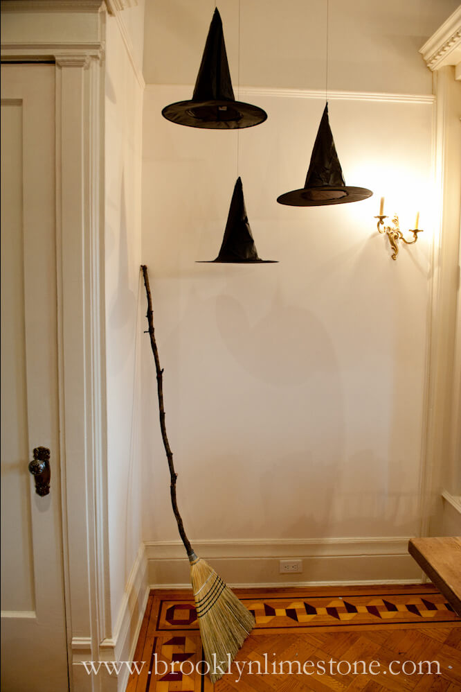 Hanging Hats Conjure Up Ghosts | DIY Indoor Halloween Decorating Ideas