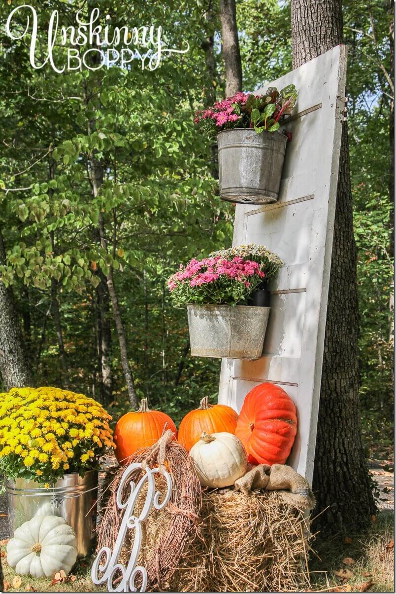 Fall Display with Mums and Pumpkins | Creative Repurposed Old Door Ideas & Projects For Your Backyard