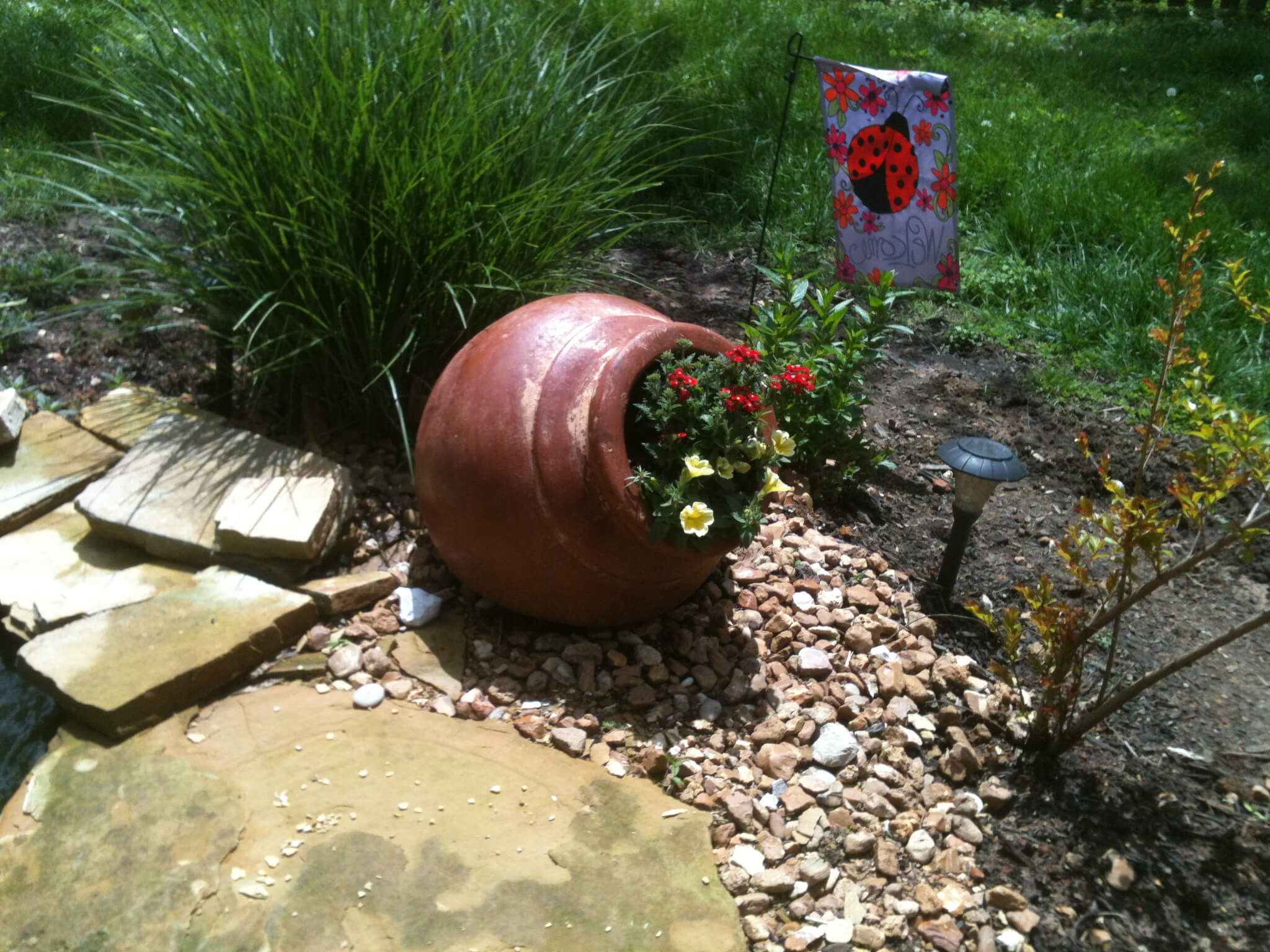 Tipped Pot with Bright Flowers