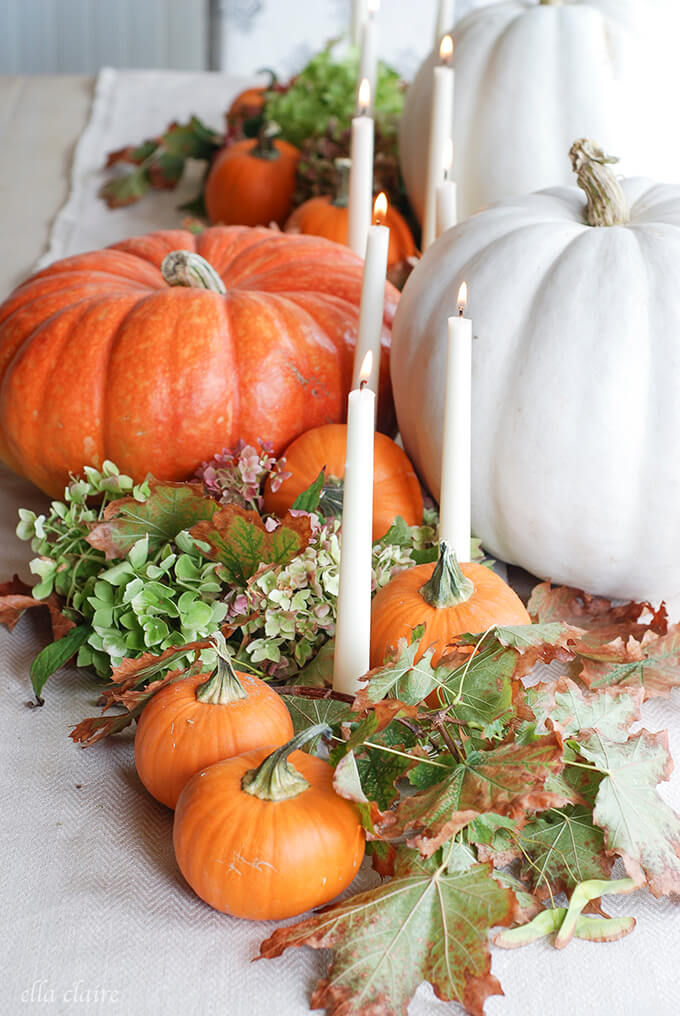 White Candles amongst Pumpkins | Best DIY Fall Centerpiece Ideas | FarmFoodFamily.com