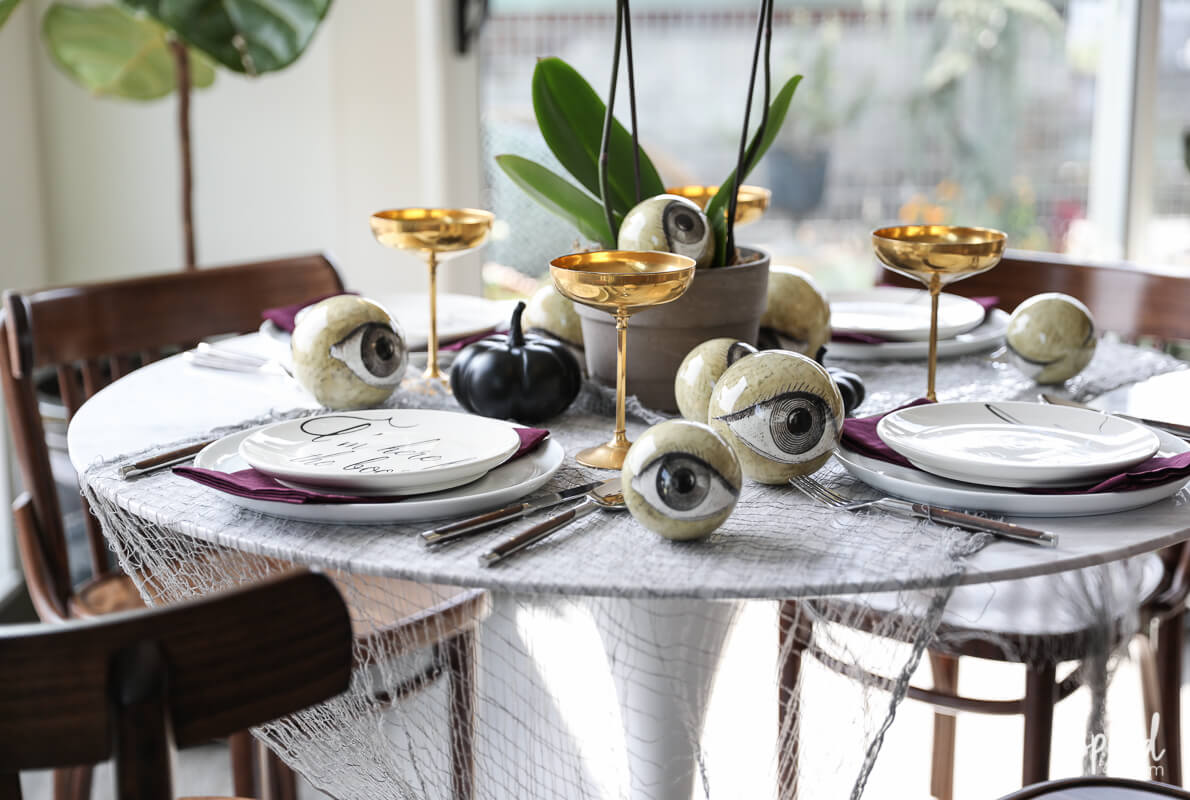 Wicked and eclectic Halloween table setting | Fun & Spooky Halloween Table Decoration Ideas - FarmFoodFamily.com