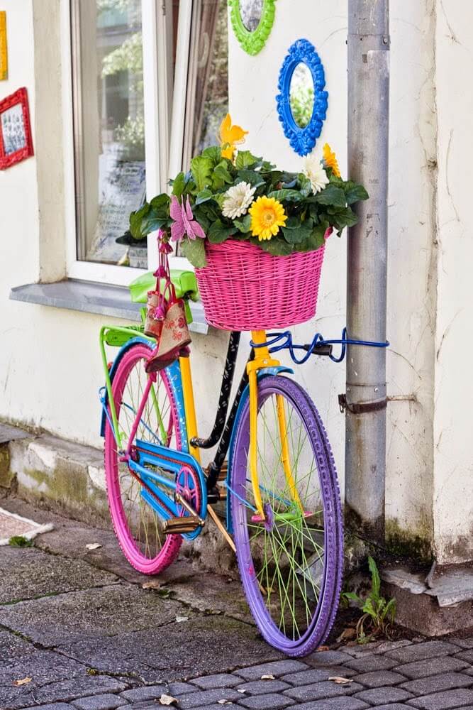 Rainbow bicycle | Bicycle Garden Planter Ideas For Backyards | FarmFoodFamily