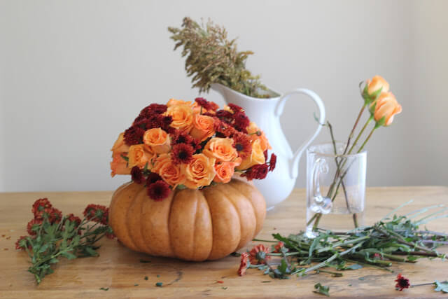 Roses, Mums & Broom Cob in a Pumpkin Vase | Best DIY Fall Centerpiece Ideas | FarmFoodFamily.com