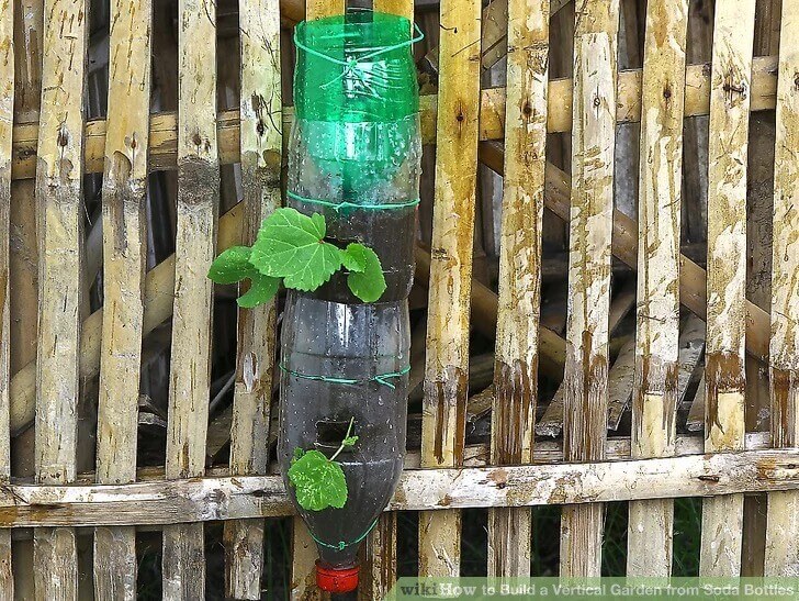 A Vertical Garden from Soda Bottles | Creative Plastic Bottle Vertical Garden Ideas - FarmFoodFamily.com