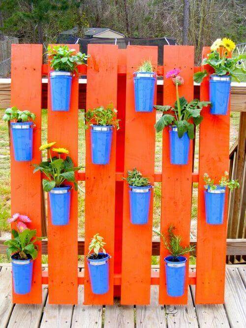 Vertical garden on Pallet | Creative Plastic Bottle Vertical Garden Ideas - FarmFoodFamily.com
