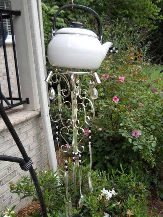 Magnificent white wind chime tea pot with glistening crystals and silverware