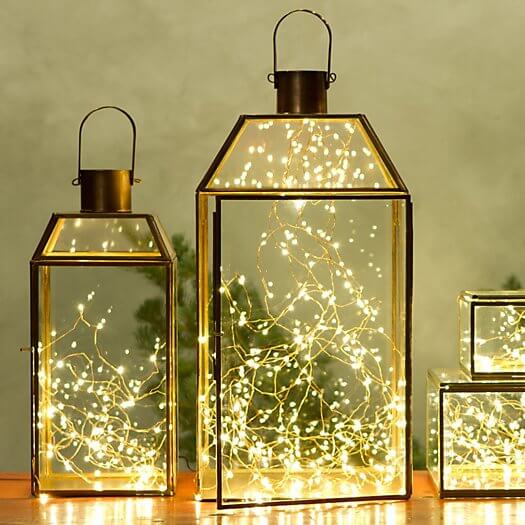 Fill glass lanterns delicate tangles lights instead
