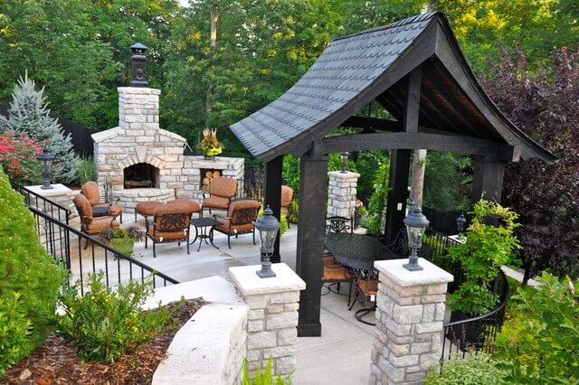 Backyard Pavilion ideas with stone fireplace