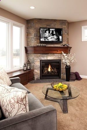 Corner fireplace with warm cherry wood mantel