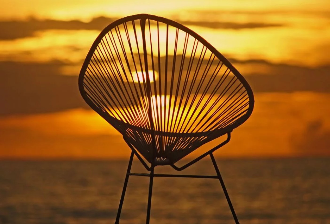 acapulco chair in sunset