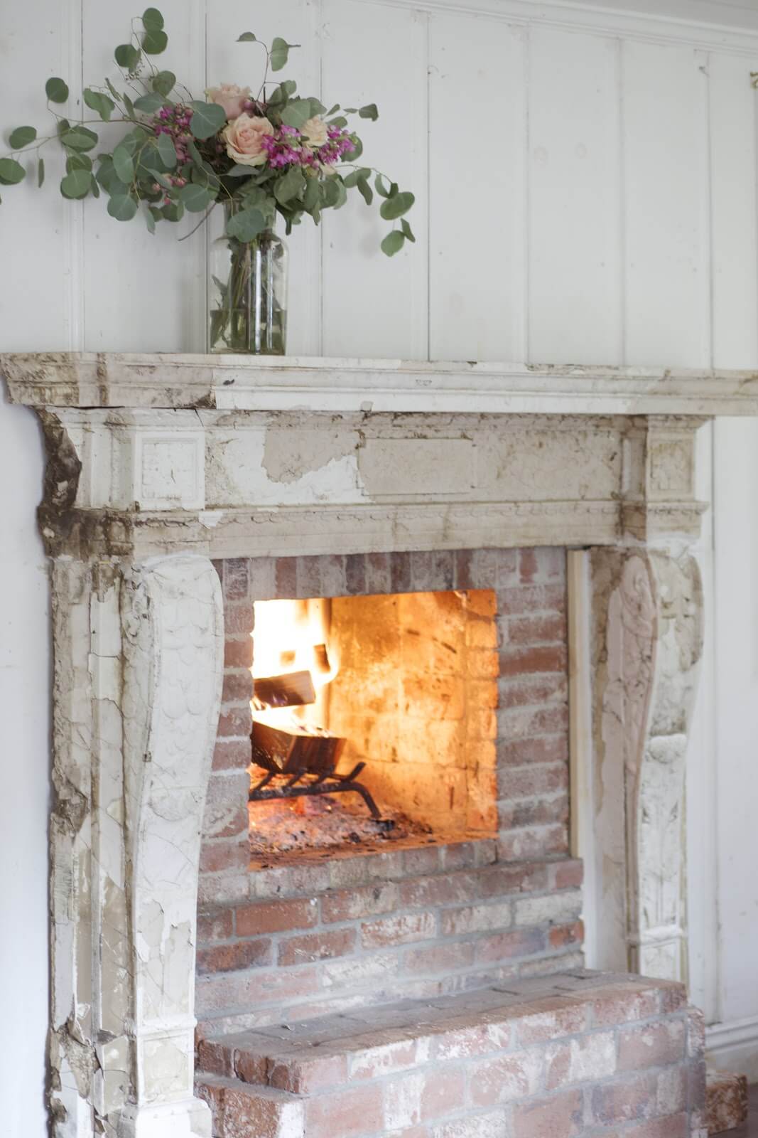 Antique fireplace with flowers