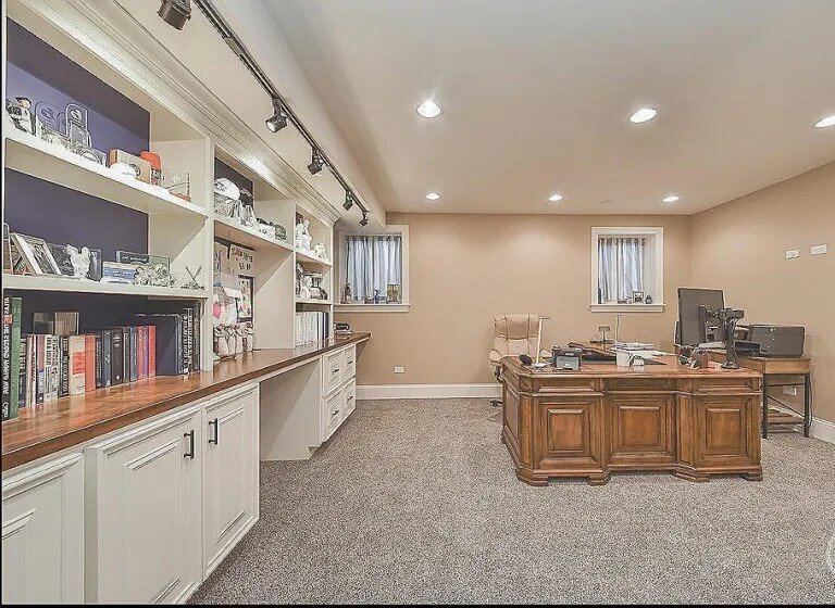 Wider basement office with track lighting
