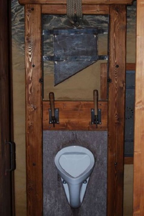 a bathroom that is designed as if it were a guillotine