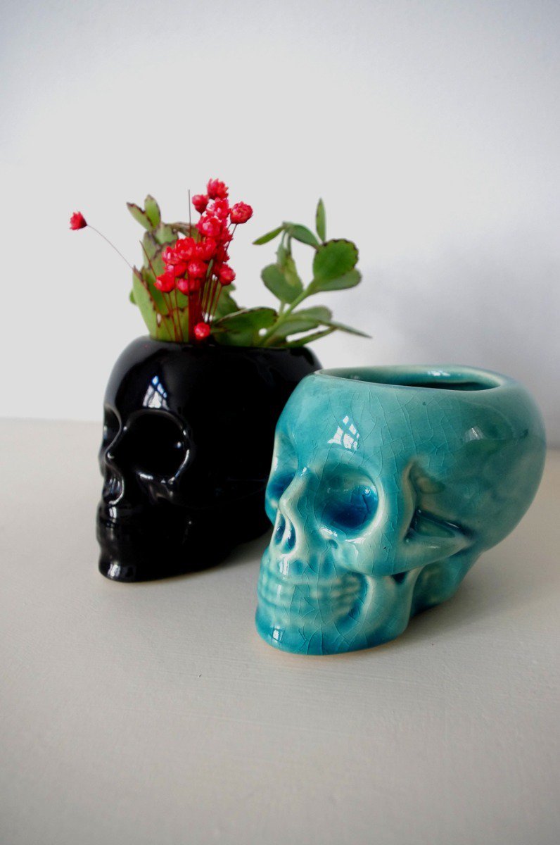 Small pots of black and blue skull
