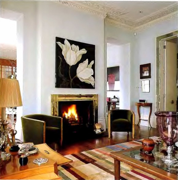 Eclectic fireplace design with wall decor