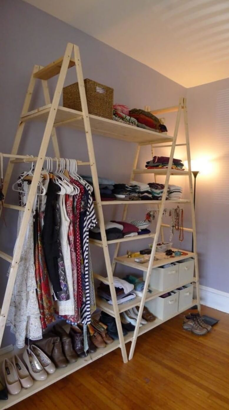 Improvised wardrobe made with wooden stairs and shelves