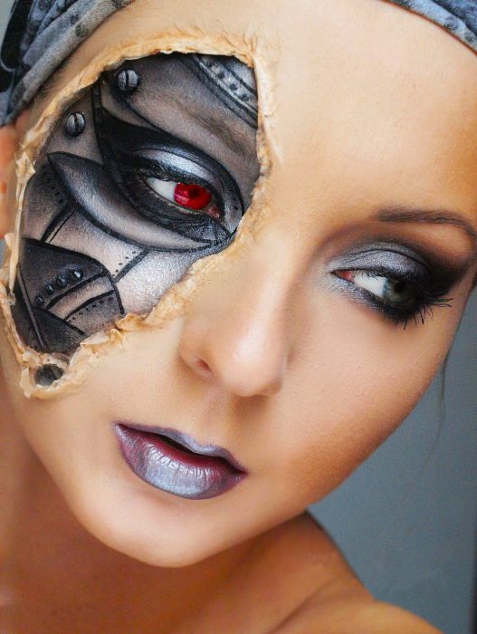 Girl with makeup for halloween with a piece of the face as a robot