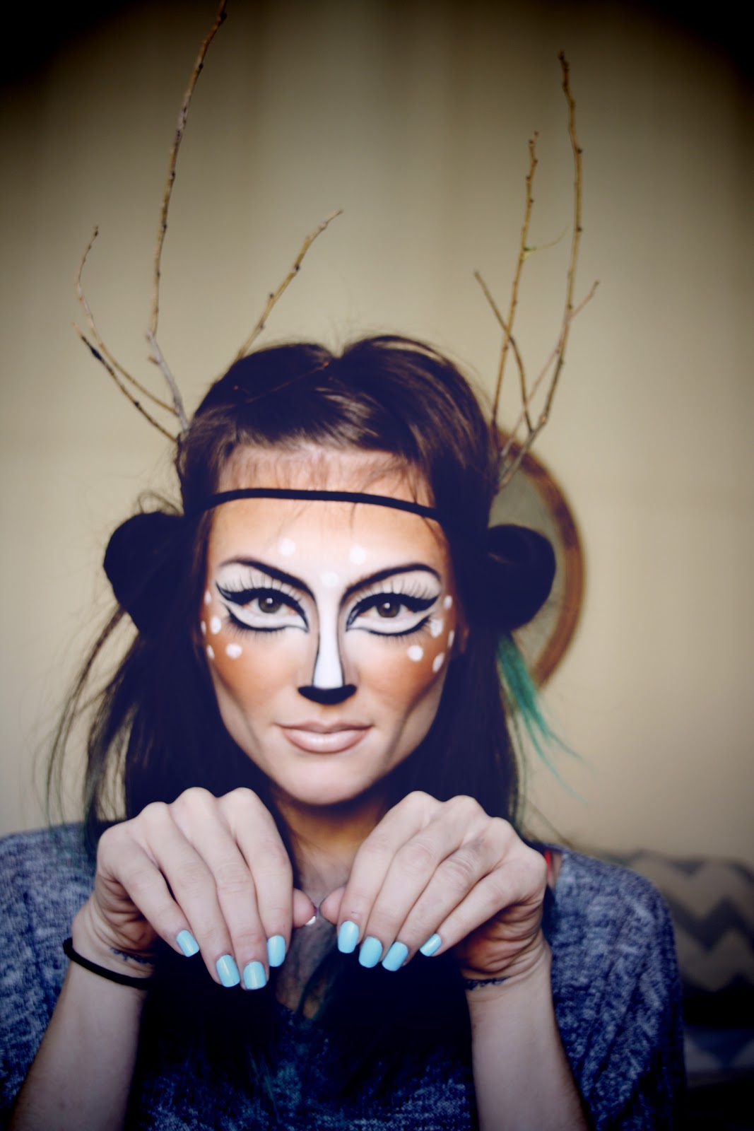 Girl with makeup for halloween as a deer