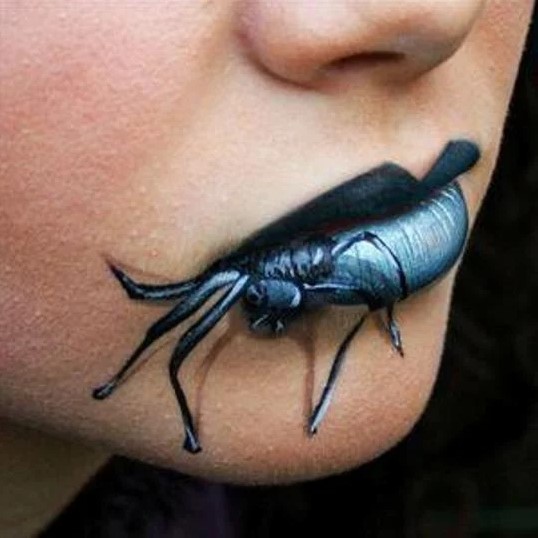 Design of lips for halloween with a spider coming out of the lips