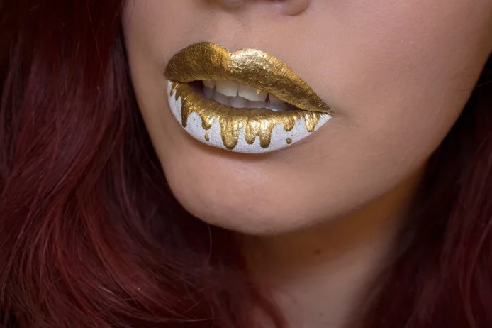 Lip design for halloween with golden and white spots