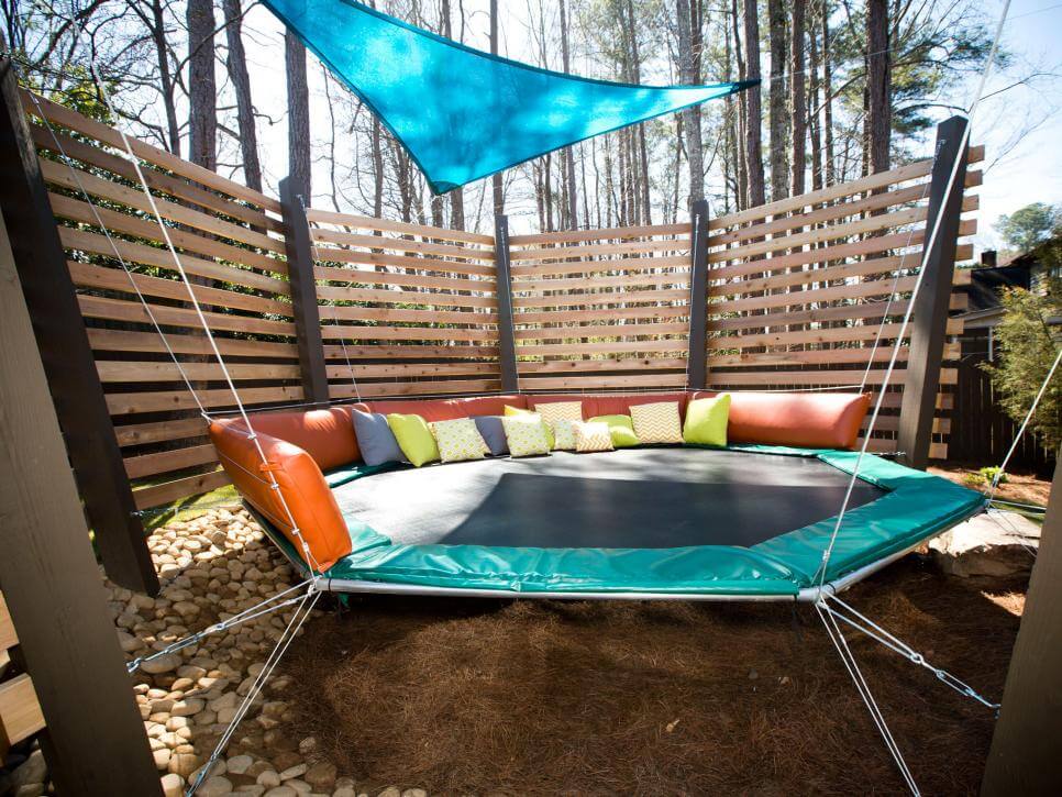 A Backyard with a small Trampoline