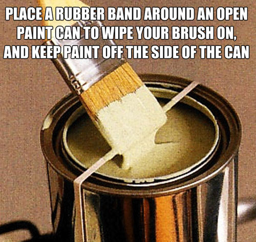 Rubber band on an open paint can wipe brush