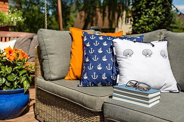 Add Some Decorating Throw Pillows to Your Backyard Seat