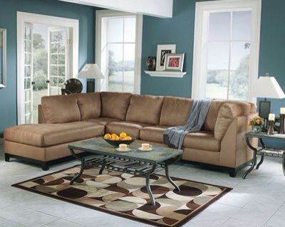 25 teal wall with brown sofa