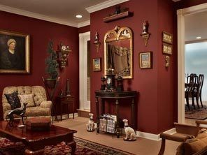 9 burgundy wall with brown sofa