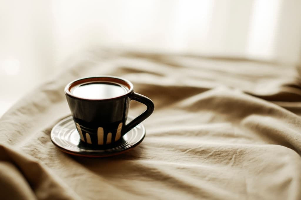 cup of coffee in bed