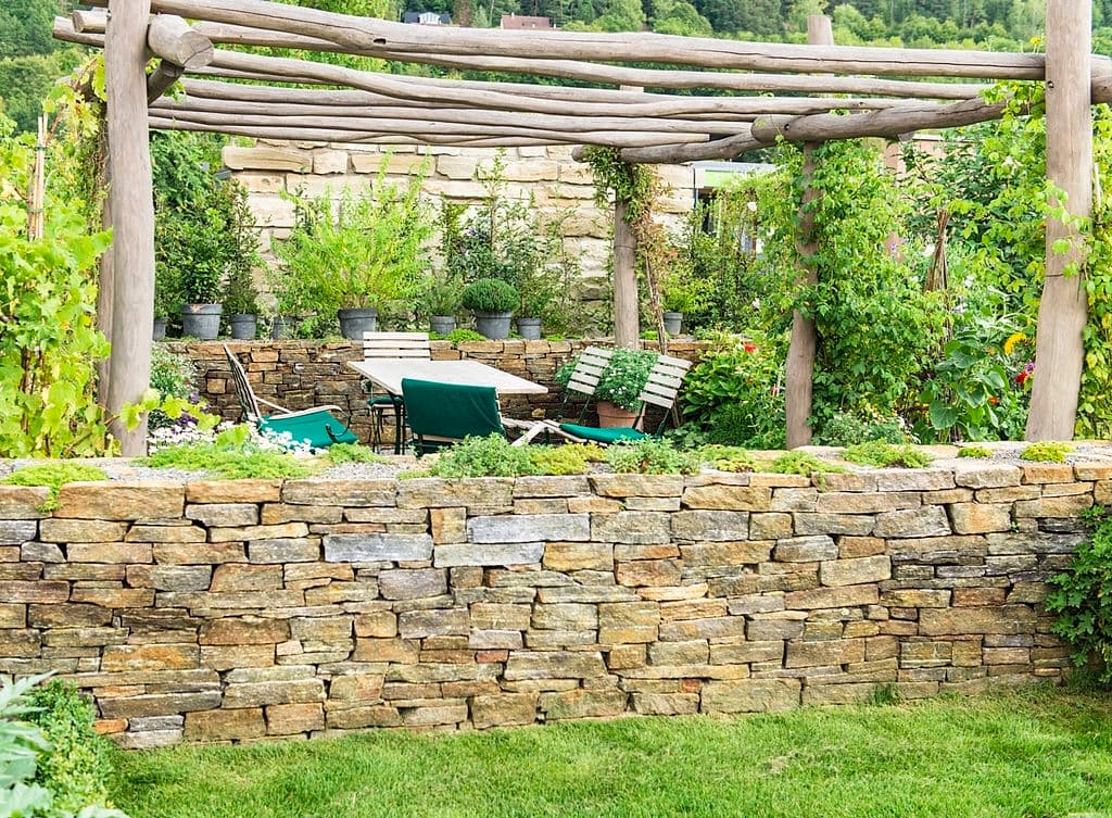 1 backyard oasis ideas with stone wall 1