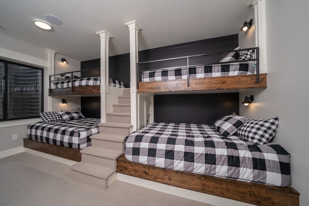 multiple bunk beds in basement bedroom