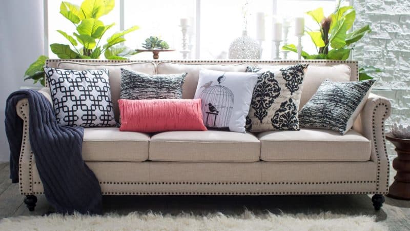 10 pink and print pillow with beige sofa