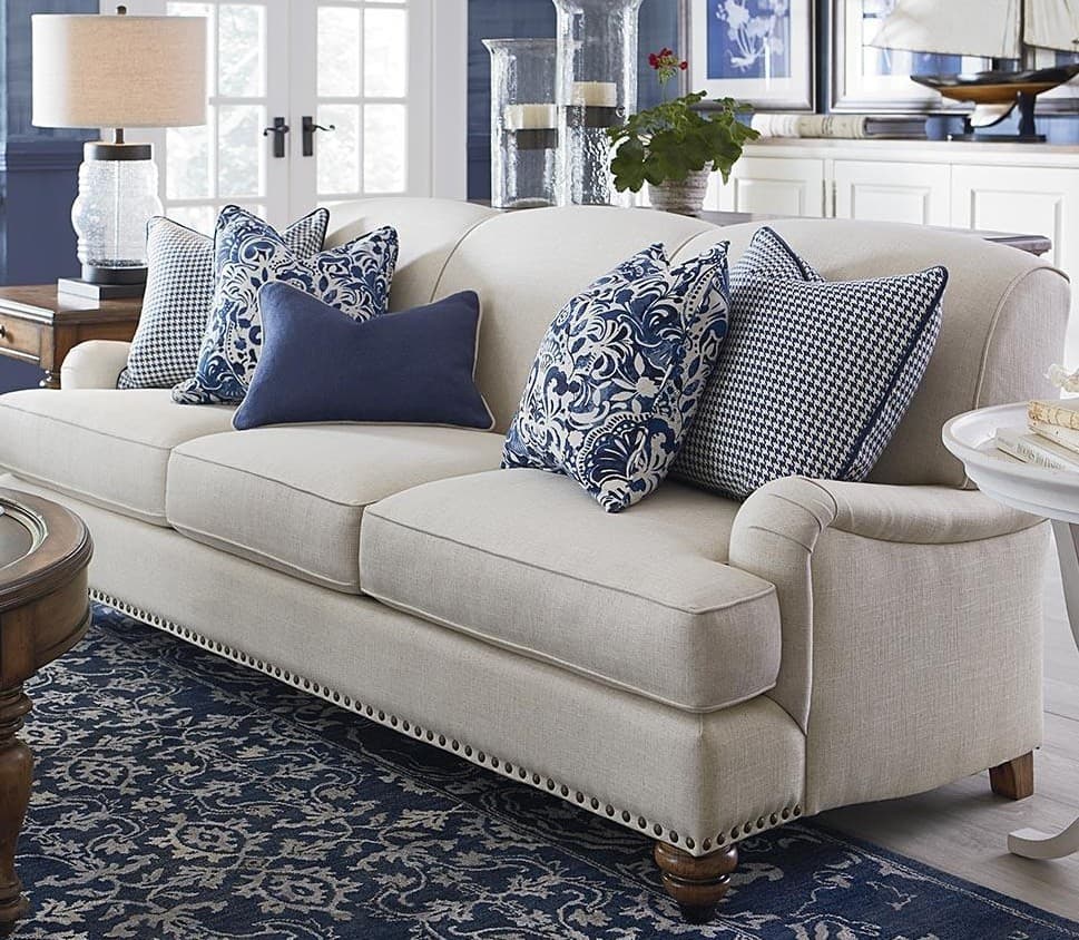 12 blue pillows with beige sofa