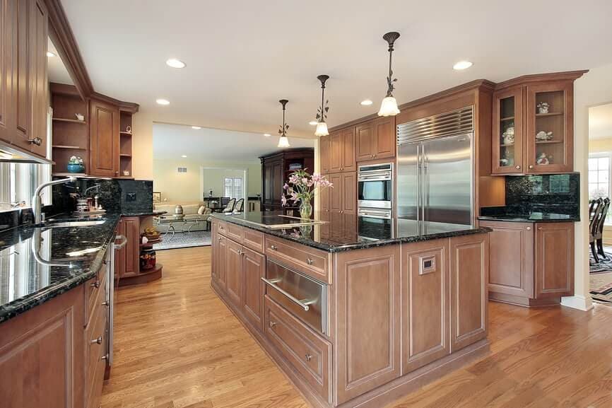 13 coffee brown cabinet with black granite countertops 1