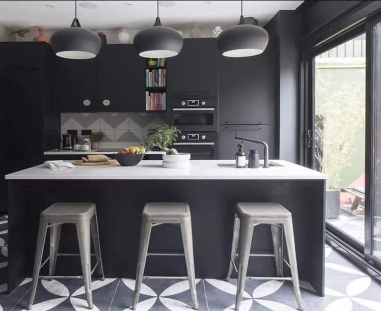 22 patterned black and white floor with dark cabinets