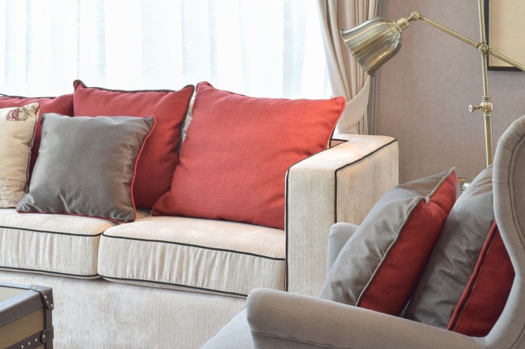 25 red pillows with beige sofas 2