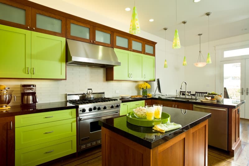 7 bright green cabinet with black granite countertops