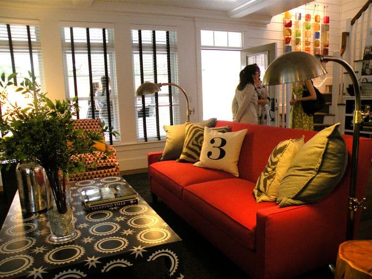 11 yellow pillows with red couch 1