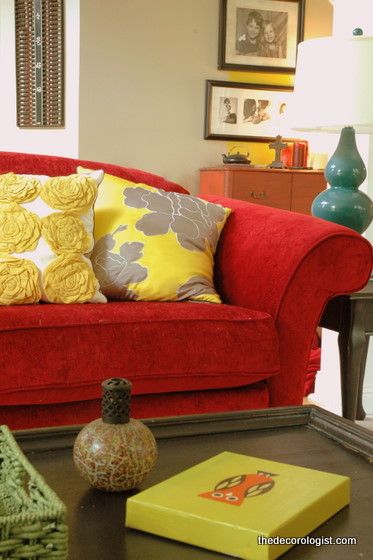 11 yellow pillows with red couch 2