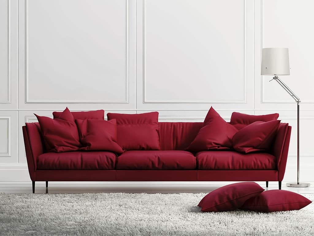 3 red pillows with red couch