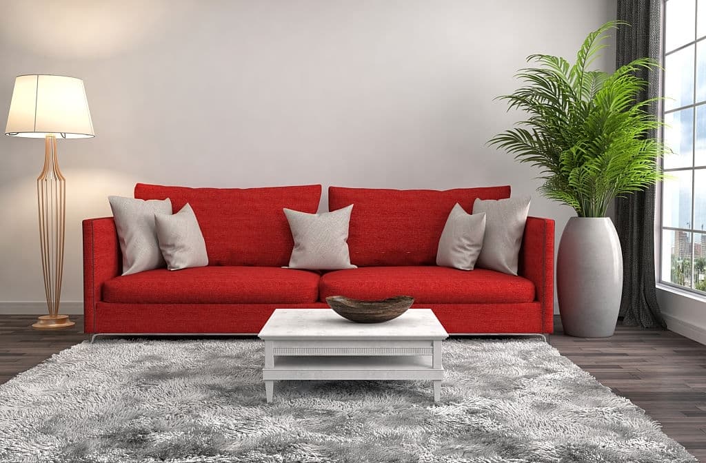 5 gray pillows with red couch 1