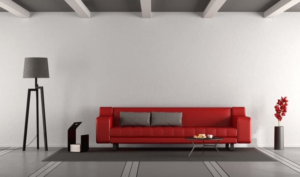 5 gray pillows with red couch