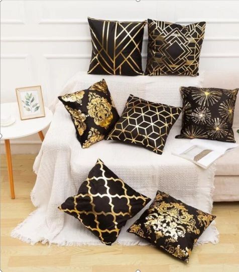 6 gold black throw pillows cushions with white couch